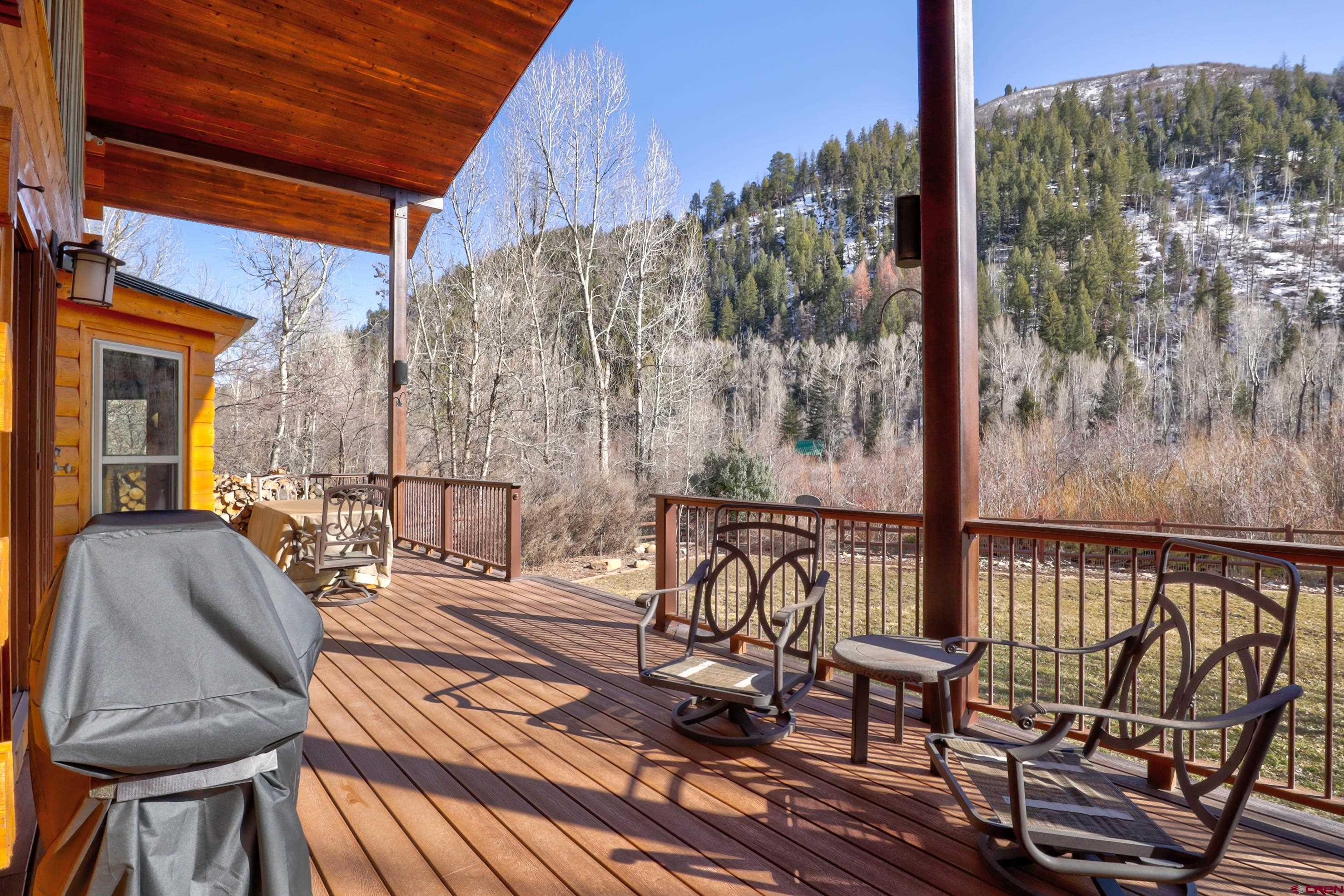 25112 Road 38.1 Dolores, CO 81323 - Photo 28 of 35 a view of balcony with wooden floor and outdoor seating