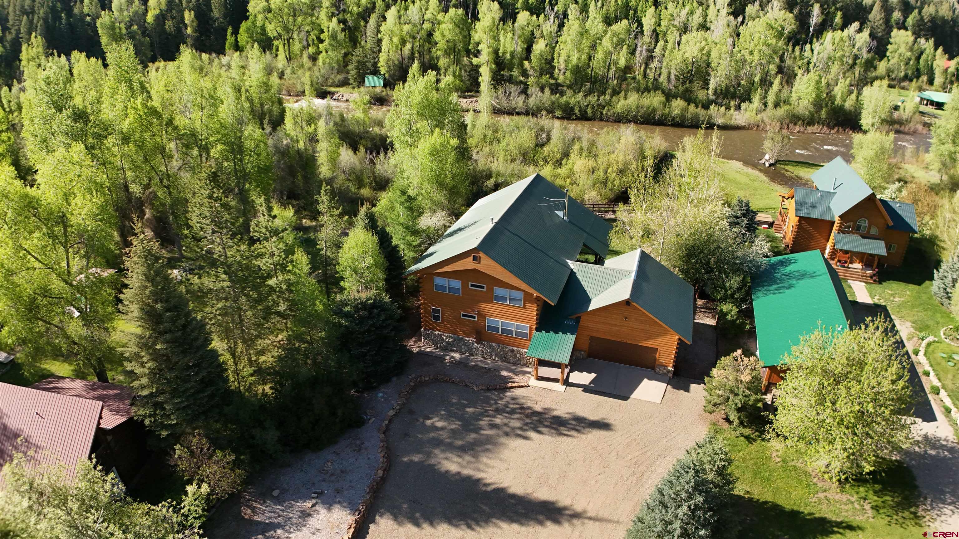 25112 Road 38.1 Dolores, CO 81323 - Photo 32 of 35 an aerial view of a house with a yard and lake view
