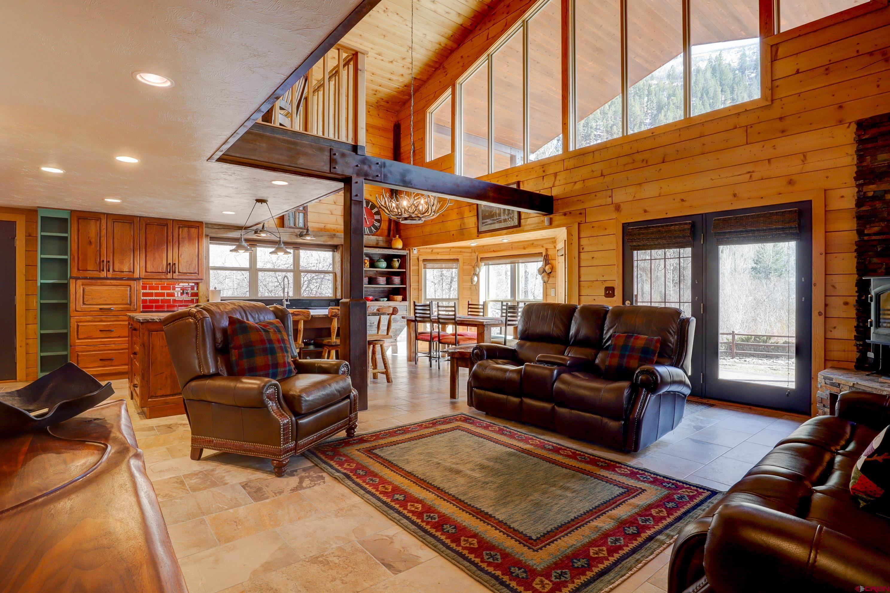 25112 Road 38.1 Dolores, CO 81323 - Photo 5 of 35 a living room with furniture a rug and a large window
