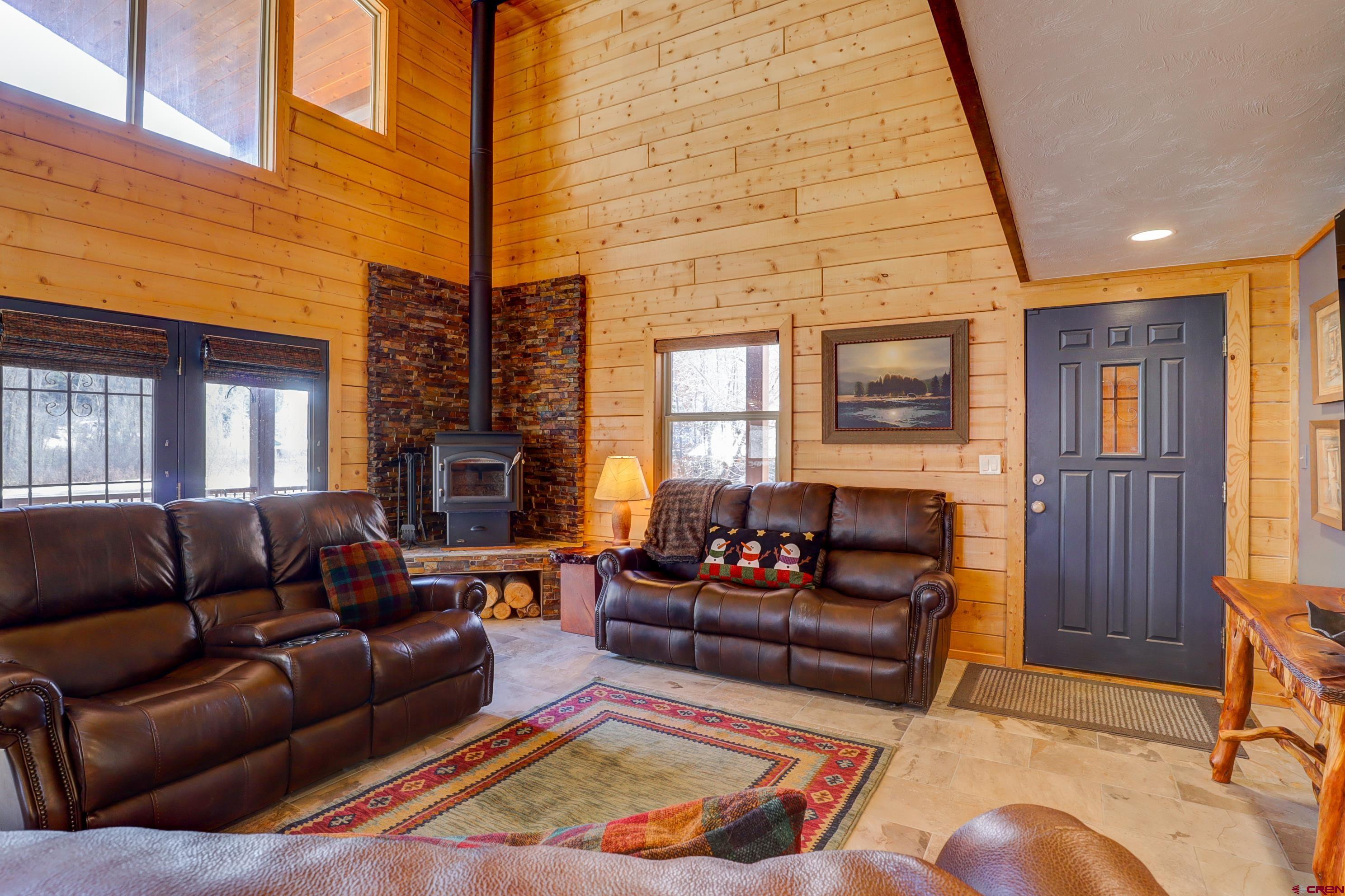 25112 Road 38.1 Dolores, CO 81323 - Photo 6 of 35 a living room with furniture and a fireplace