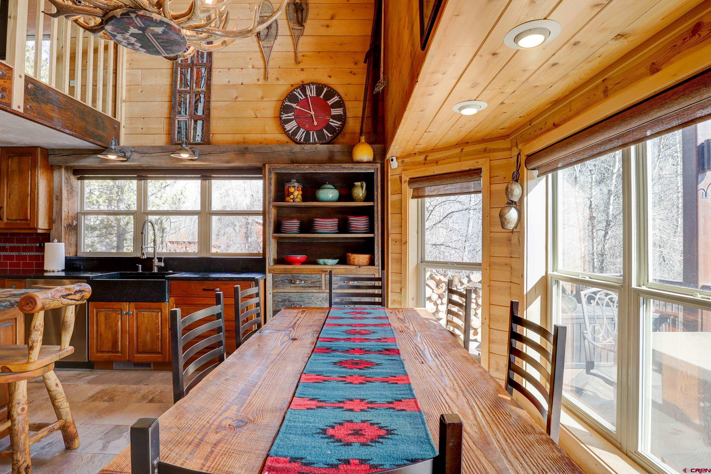 25112 Road 38.1 Dolores, CO 81323 - Photo 9 of 35 a group of people sitting in front of retail shop