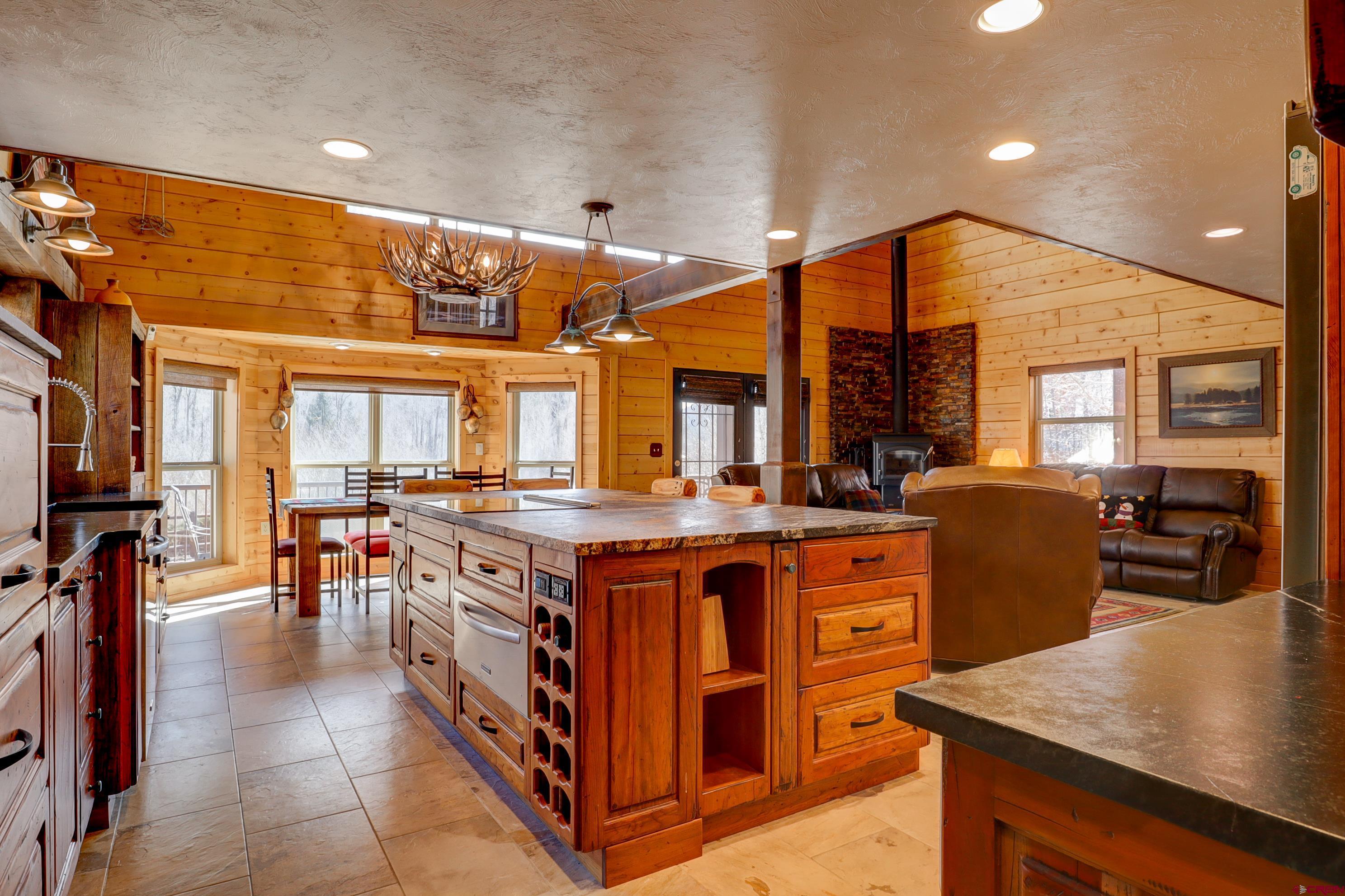 25112 Road 38.1 Dolores, CO 81323 - Photo 10 of 35 a open kitchen with stainless steel appliances granite countertop a stove and refrigerator