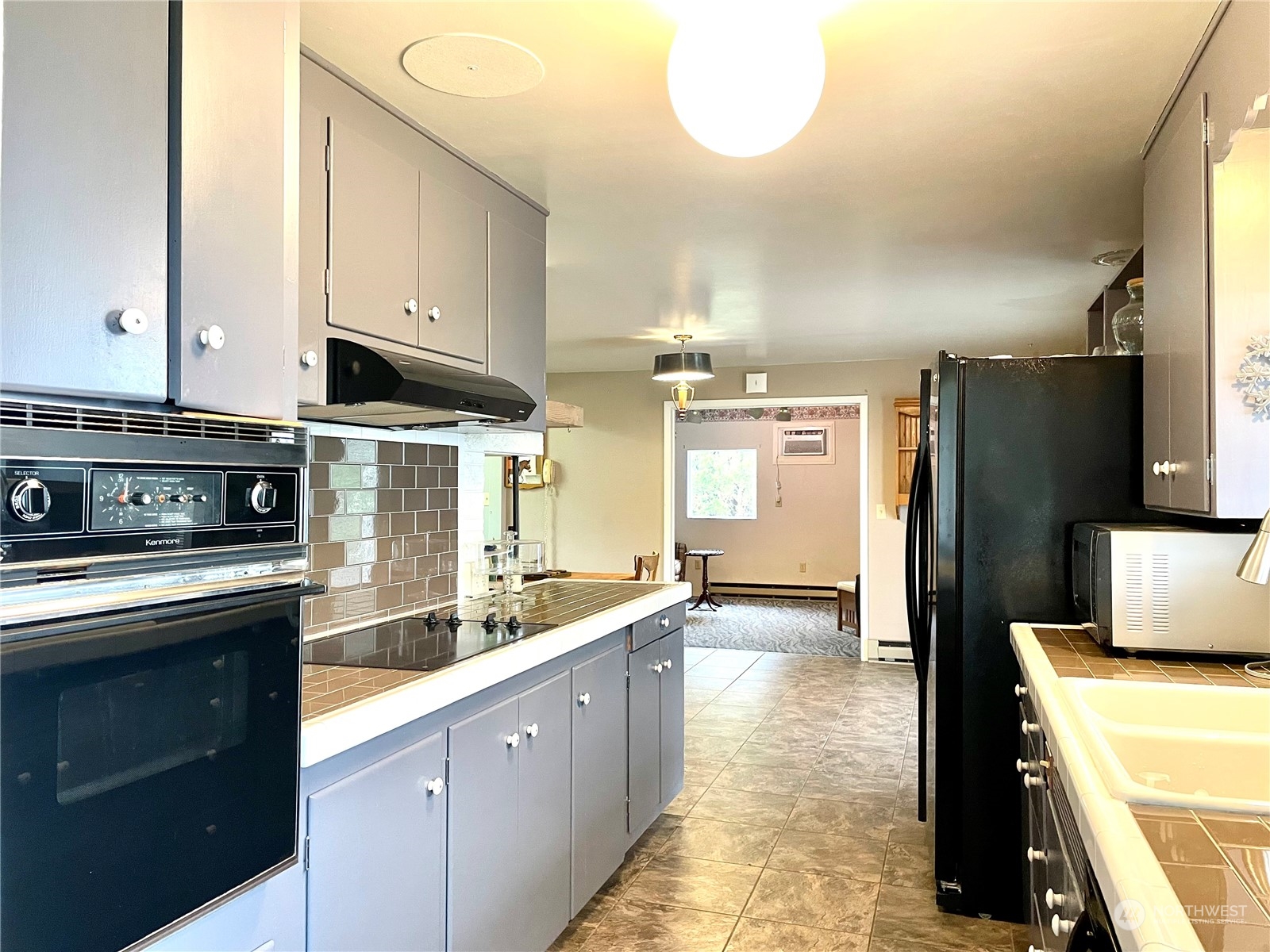 400 Patrick Road Ephrata, WA 98823 - Photo 6 of 38 a kitchen with stainless steel appliances a stove a sink and a refrigerator