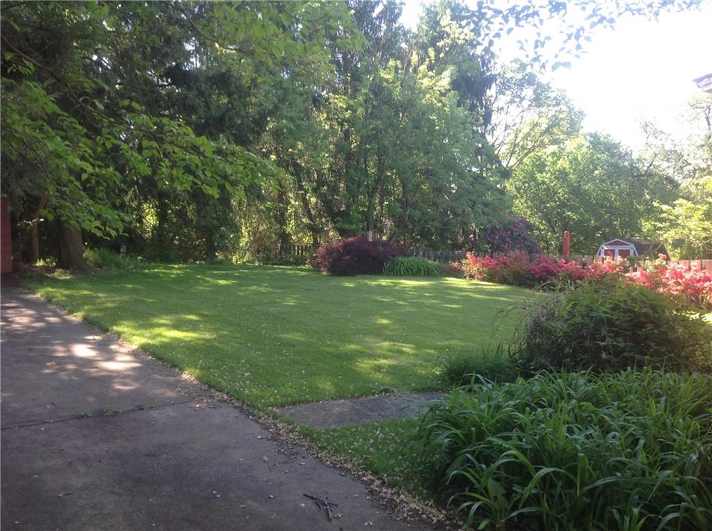 10 Woodside Road Pittsburgh, PA 15221 - Photo 2 of 16 Back yard and driveway leading to one car garage.