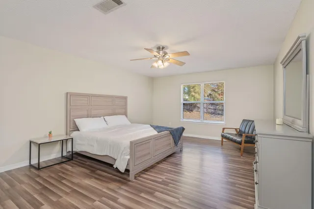 a white bath tub sitting next to a white sink