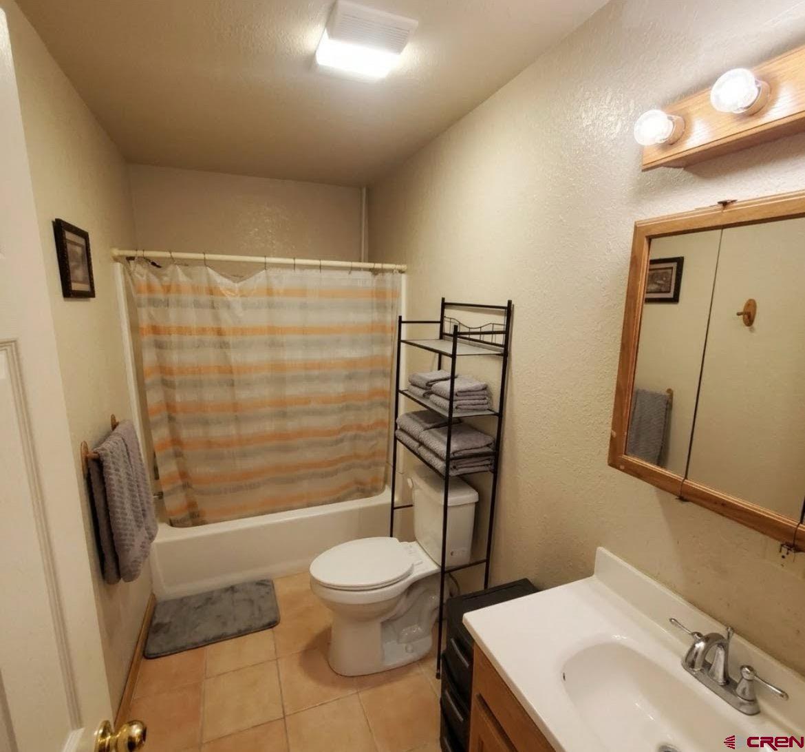 816 Main Street Manassa, CO 81141 - Photo 17 of 23 a bathroom with a sink toilet and shower