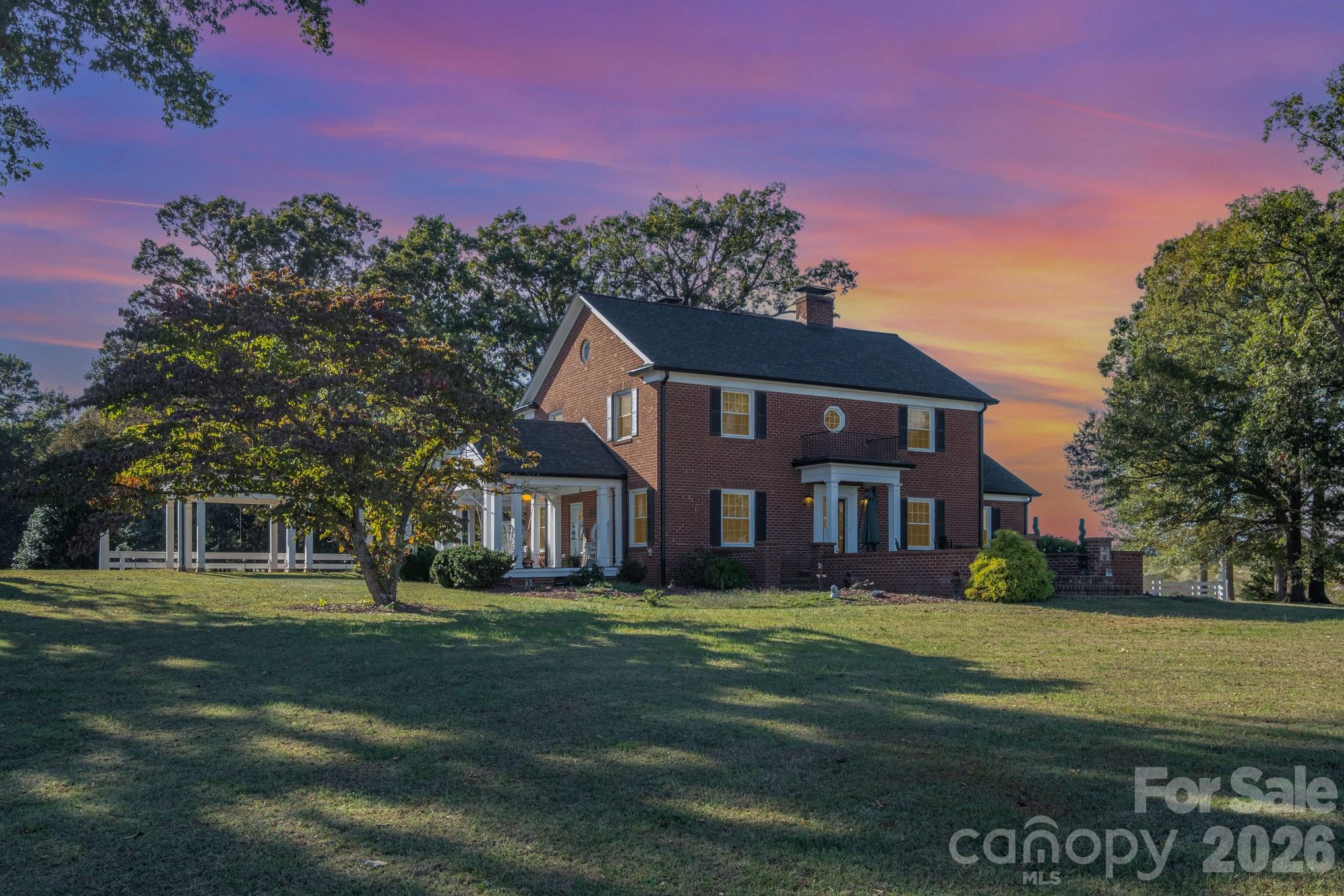 1783 Reepsville Road Lincolnton, NC 28092 - Photo 1 of 45 a front view of a house with a garden