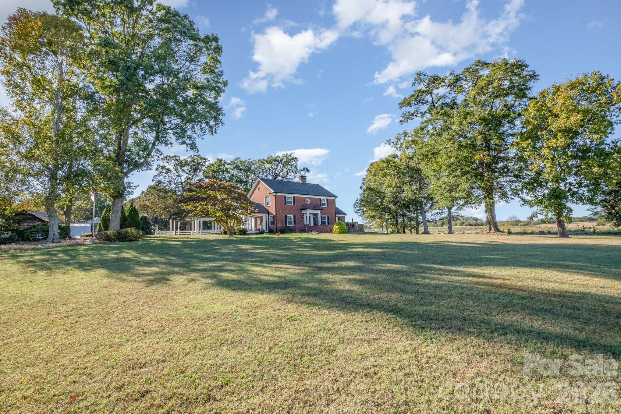 1783 Reepsville Road Lincolnton, NC 28092 - Photo 12 of 45 a view of a yard in front of a house with a large tree