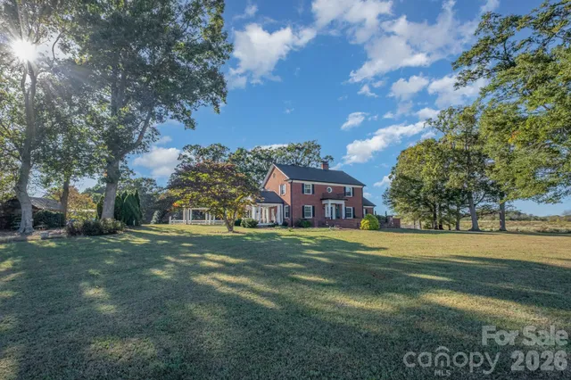 a front view of a house with outdoor seating