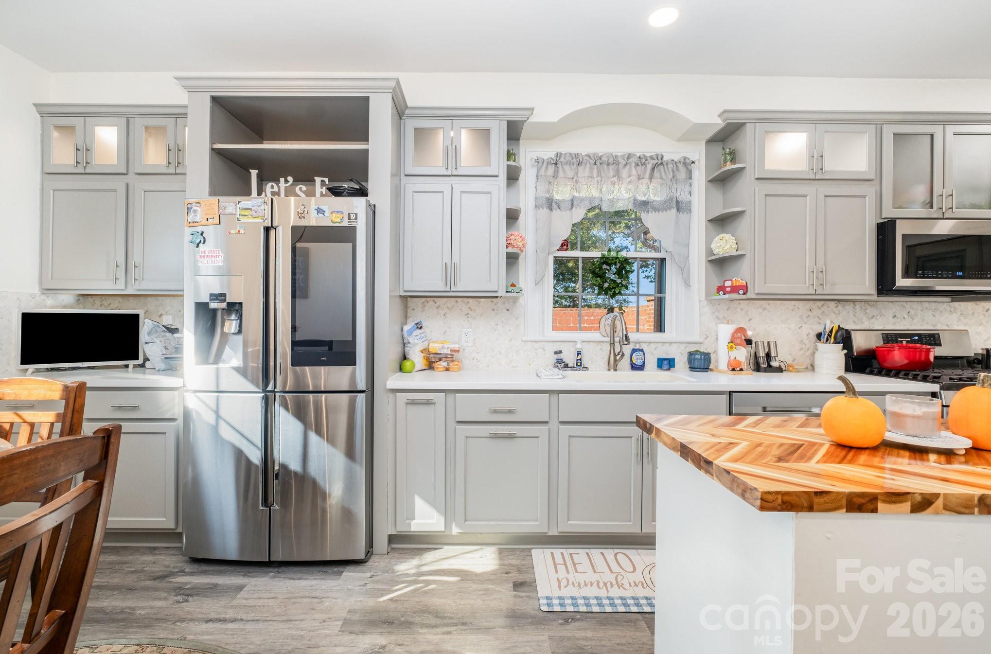 1783 Reepsville Road Lincolnton, NC 28092 - Photo 2 of 45 a kitchen with stainless steel appliances granite countertop a refrigerator and a stove top oven