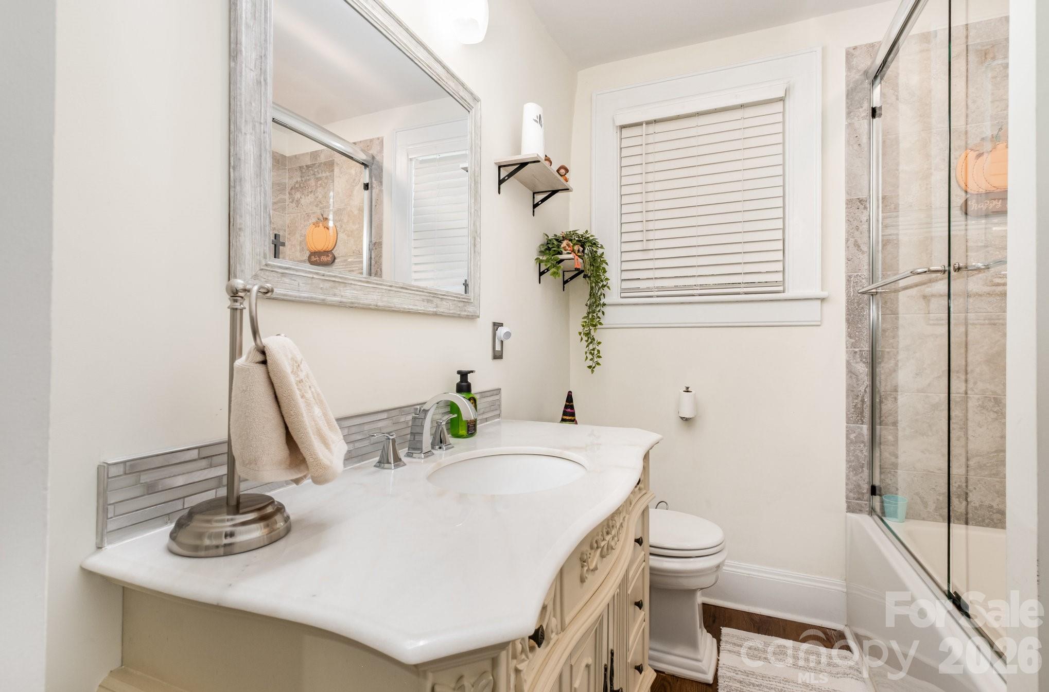 1783 Reepsville Road Lincolnton, NC 28092 - Photo 28 of 45 a bathroom with a sink a toilet and mirror