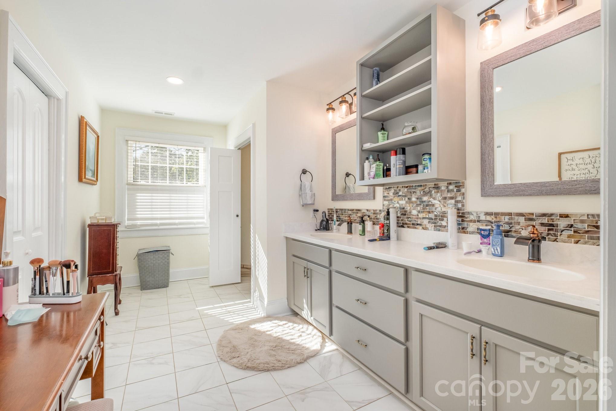1783 Reepsville Road Lincolnton, NC 28092 - Photo 5 of 45 a bathroom with a sink double vanity and a mirror