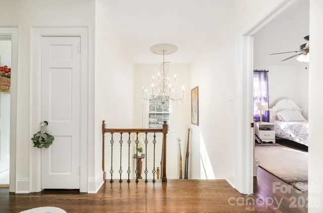 a living room with furniture a rug and a fireplace