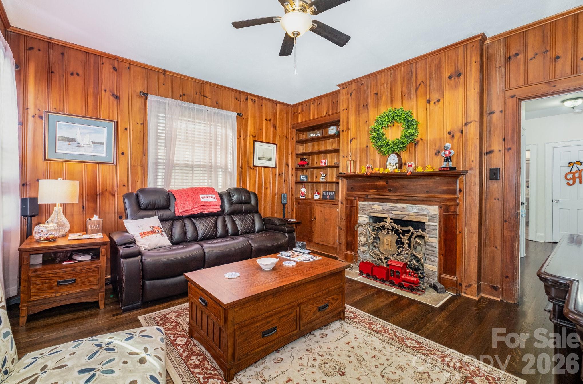 1783 Reepsville Road Lincolnton, NC 28092 - Photo 7 of 45 a living room with furniture a rug and a fireplace