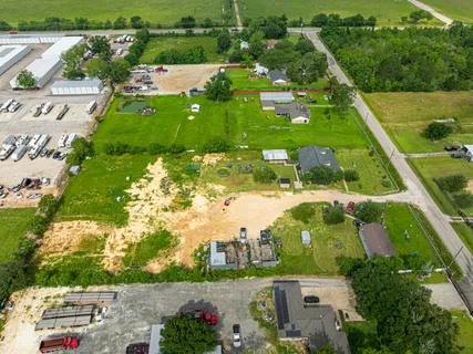 an aerial view of a houses with outdoor space and street view