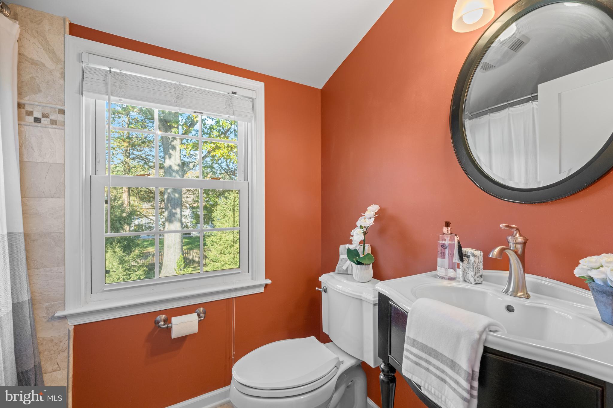 124 Deepdale Road Wayne, PA 19087 - Photo 25 of 35 a bathroom with a sink a toilet and a mirror
