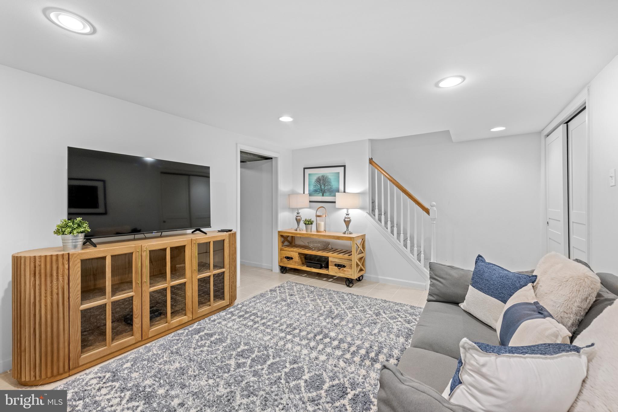 124 Deepdale Road Wayne, PA 19087 - Photo 29 of 35 a living room with furniture and a flat screen tv