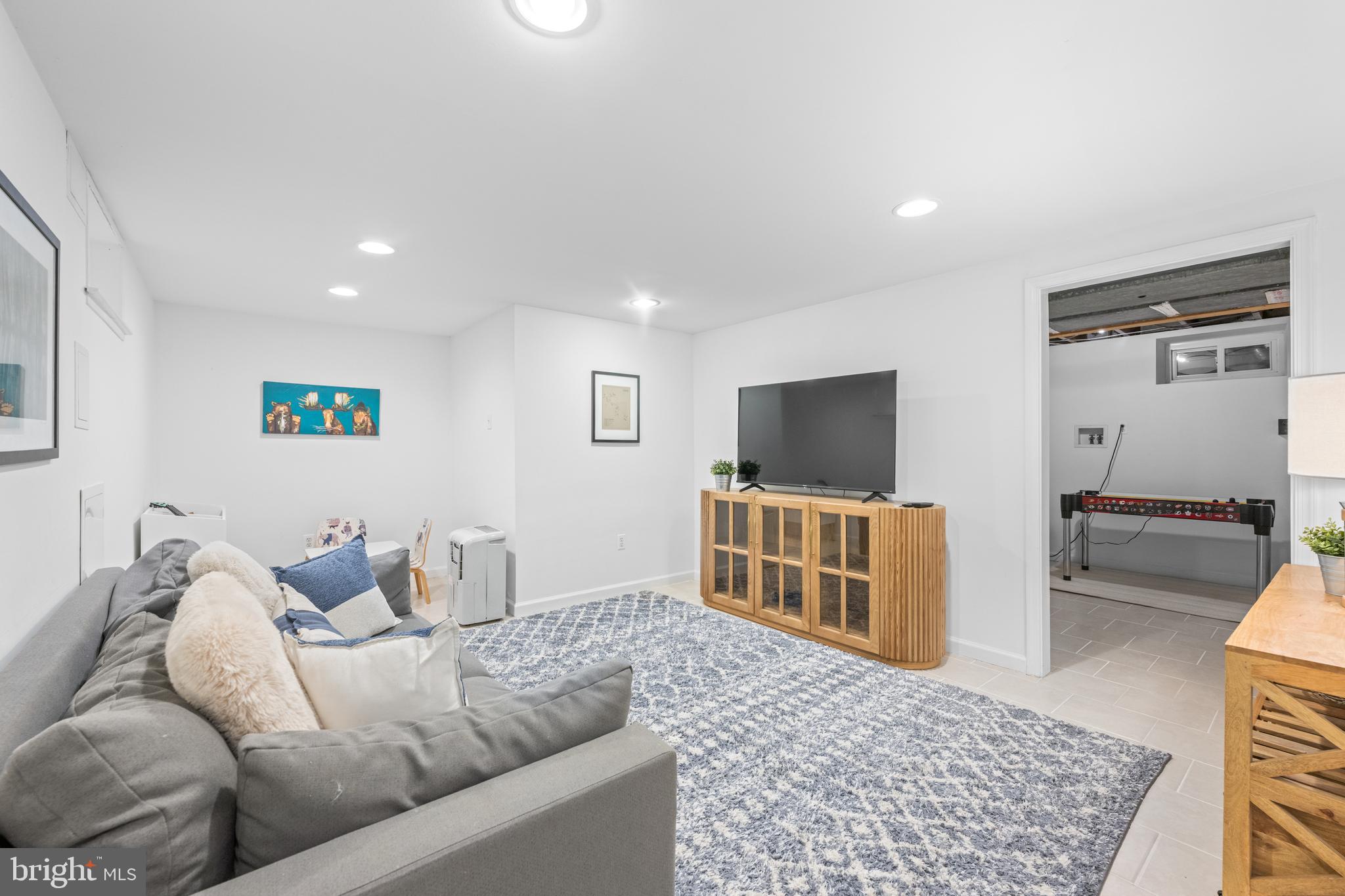 124 Deepdale Road Wayne, PA 19087 - Photo 30 of 35 a living room with furniture and a flat screen tv