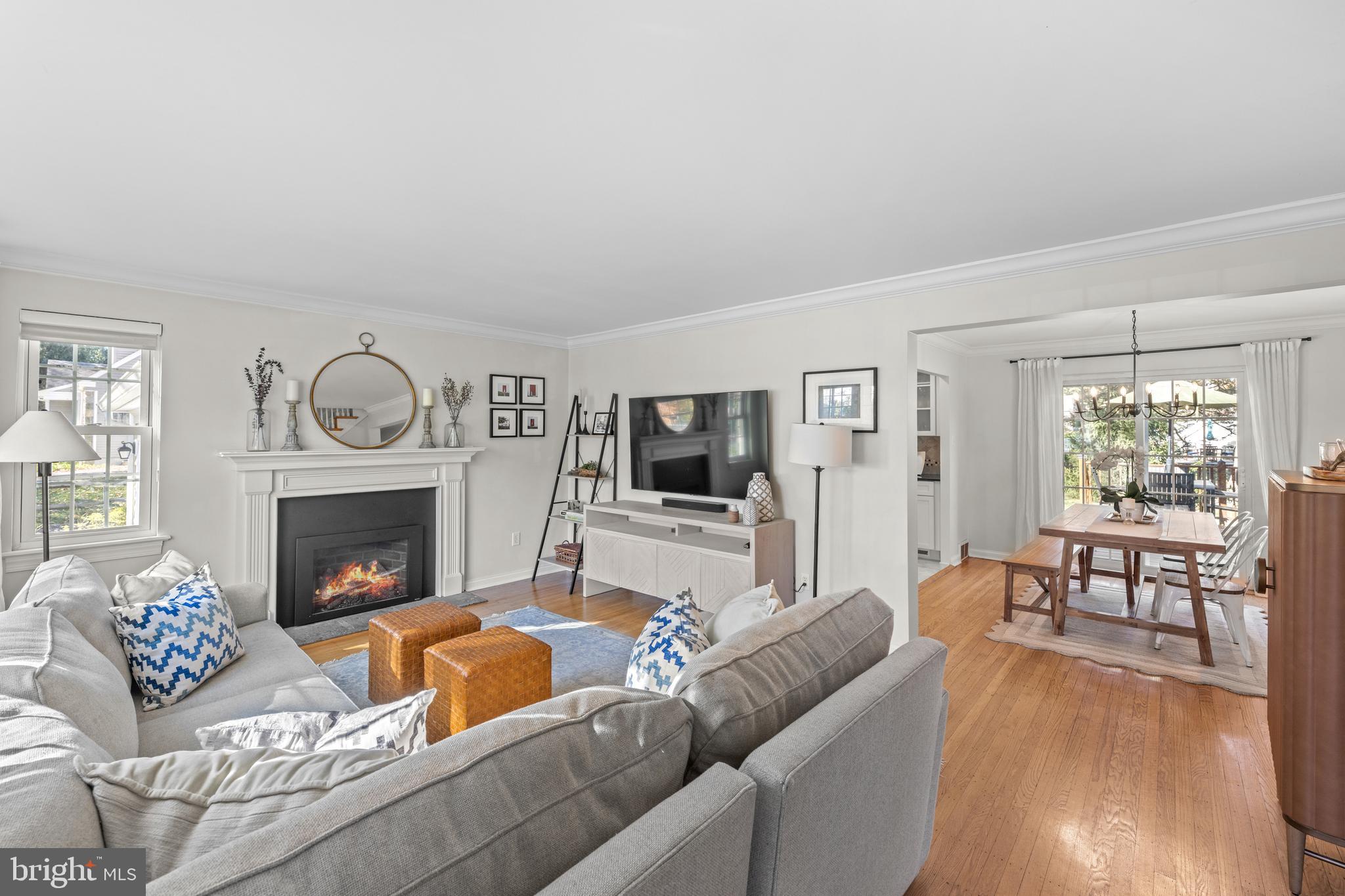 124 Deepdale Road Wayne, PA 19087 - Photo 5 of 35 a living room with furniture a fireplace and a flat screen tv