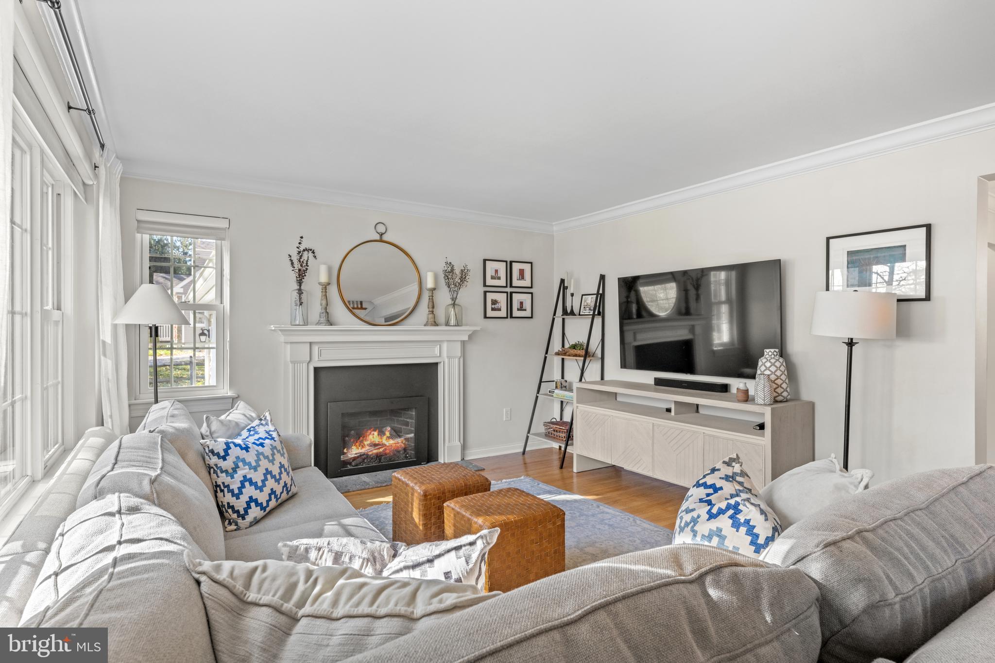 124 Deepdale Road Wayne, PA 19087 - Photo 6 of 35 a living room with furniture a fireplace and a flat screen tv