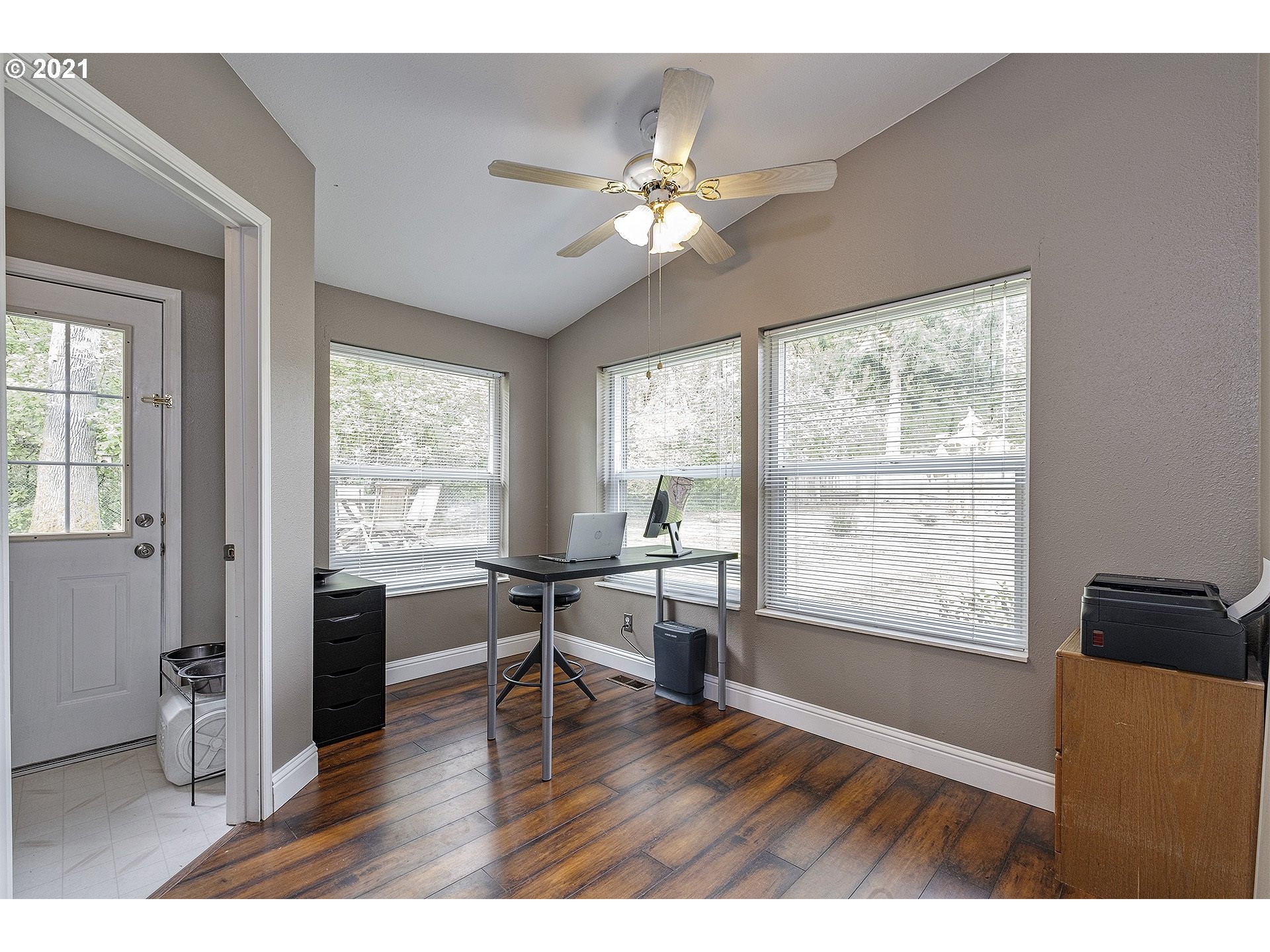 4300 Mapleton Drive West Linn, OR 97068 - Photo 14 of 32 a view of a livingroom with furniture window and wooden floor