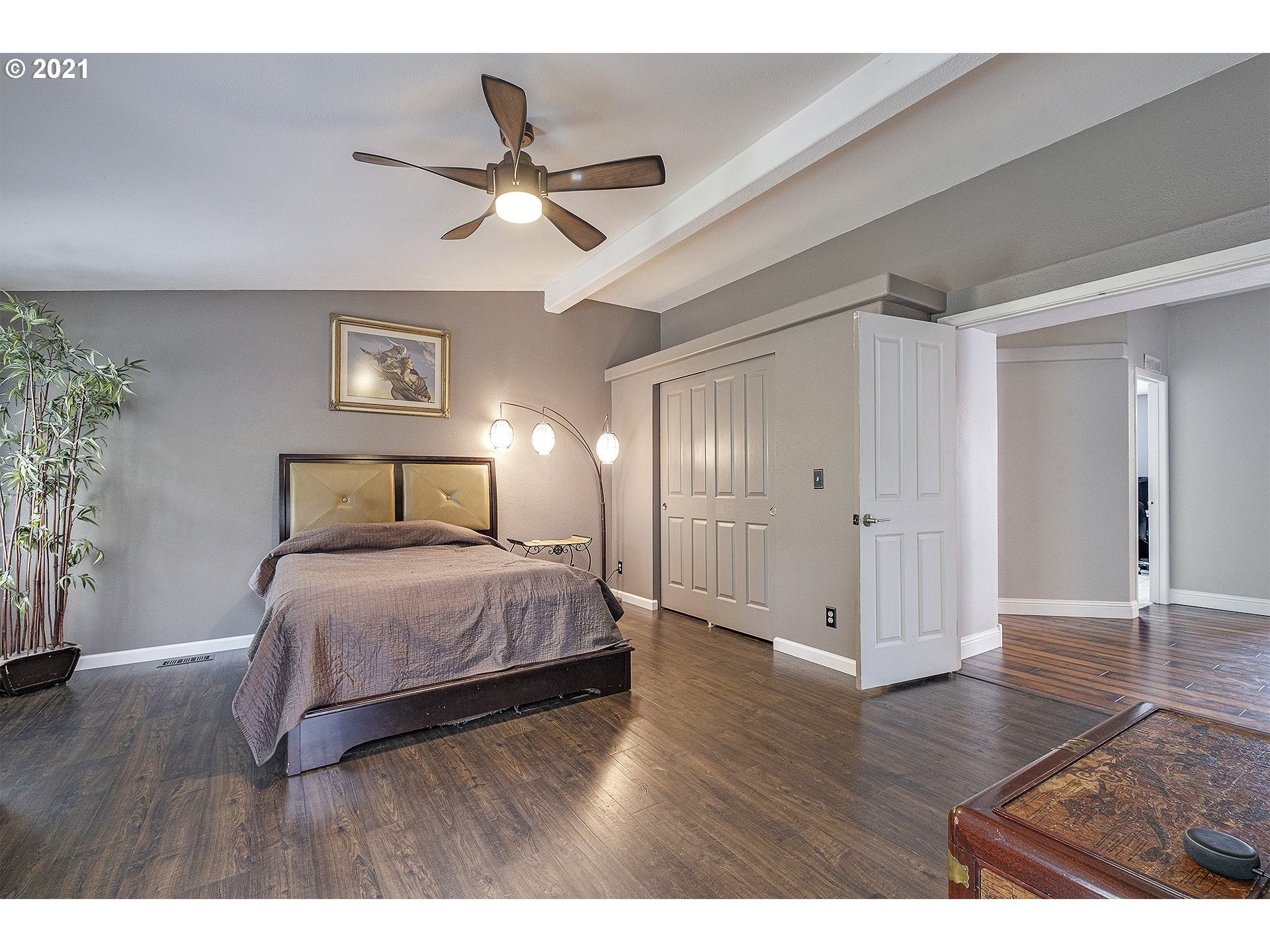 4300 Mapleton Drive West Linn, OR 97068 - Photo 18 of 32 a bedroom with a bed and a chandelier