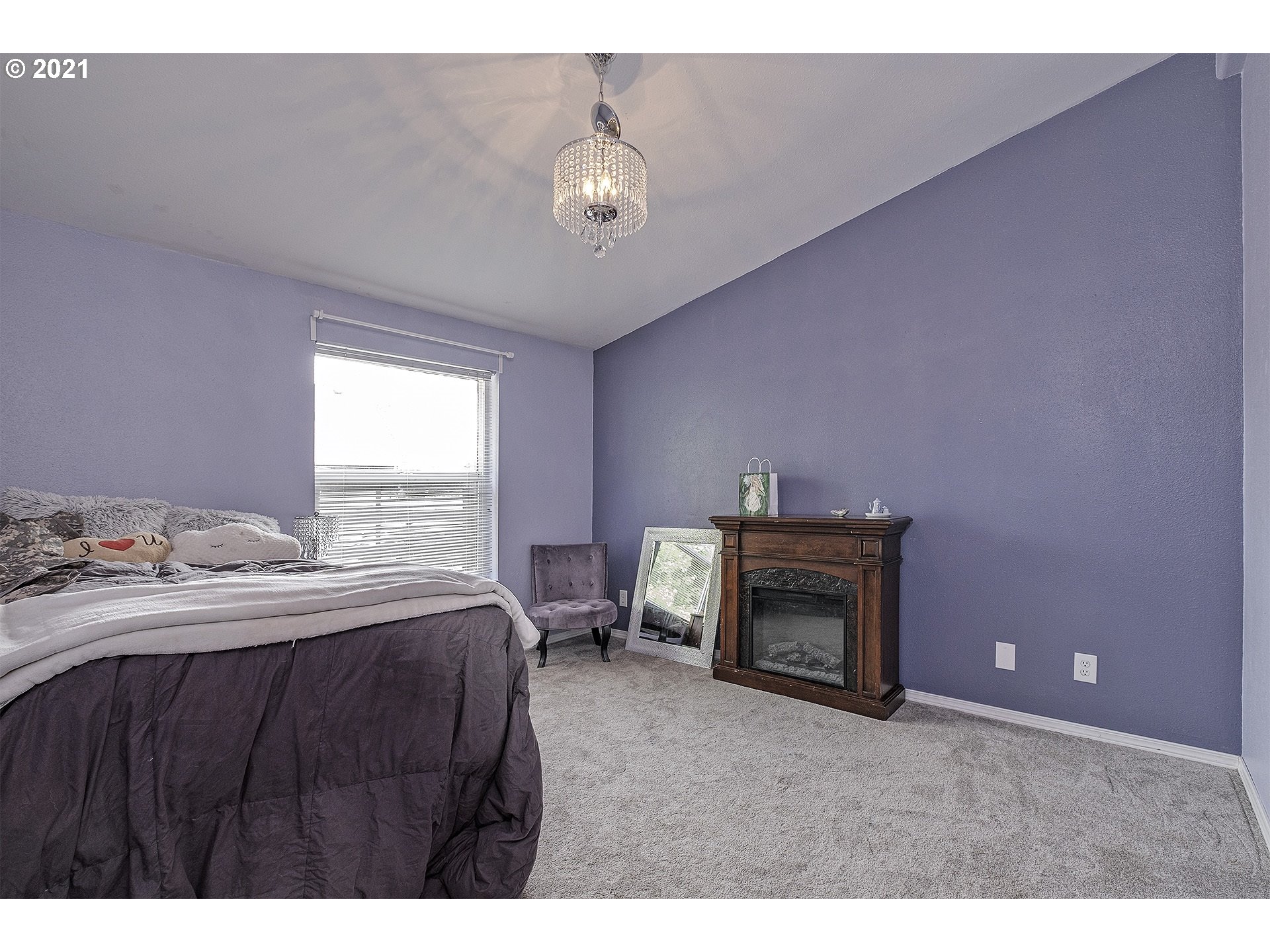 4300 Mapleton Drive West Linn, OR 97068 - Photo 22 of 32 a bedroom with a bed and a fireplace