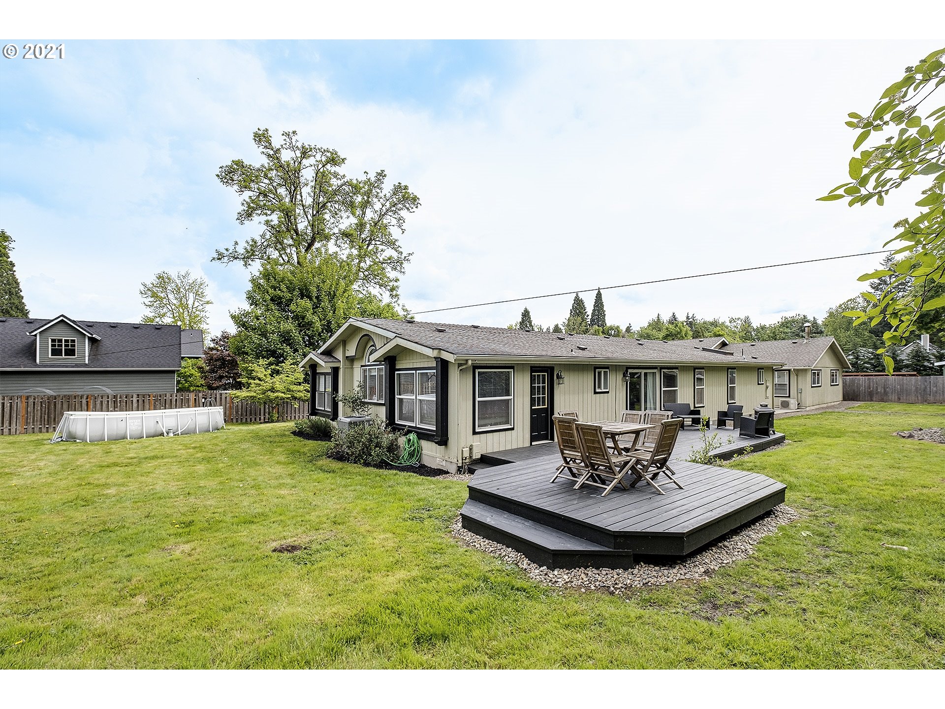 4300 Mapleton Drive West Linn, OR 97068 - Photo 28 of 32 a view of a house with a yard and swimming pool