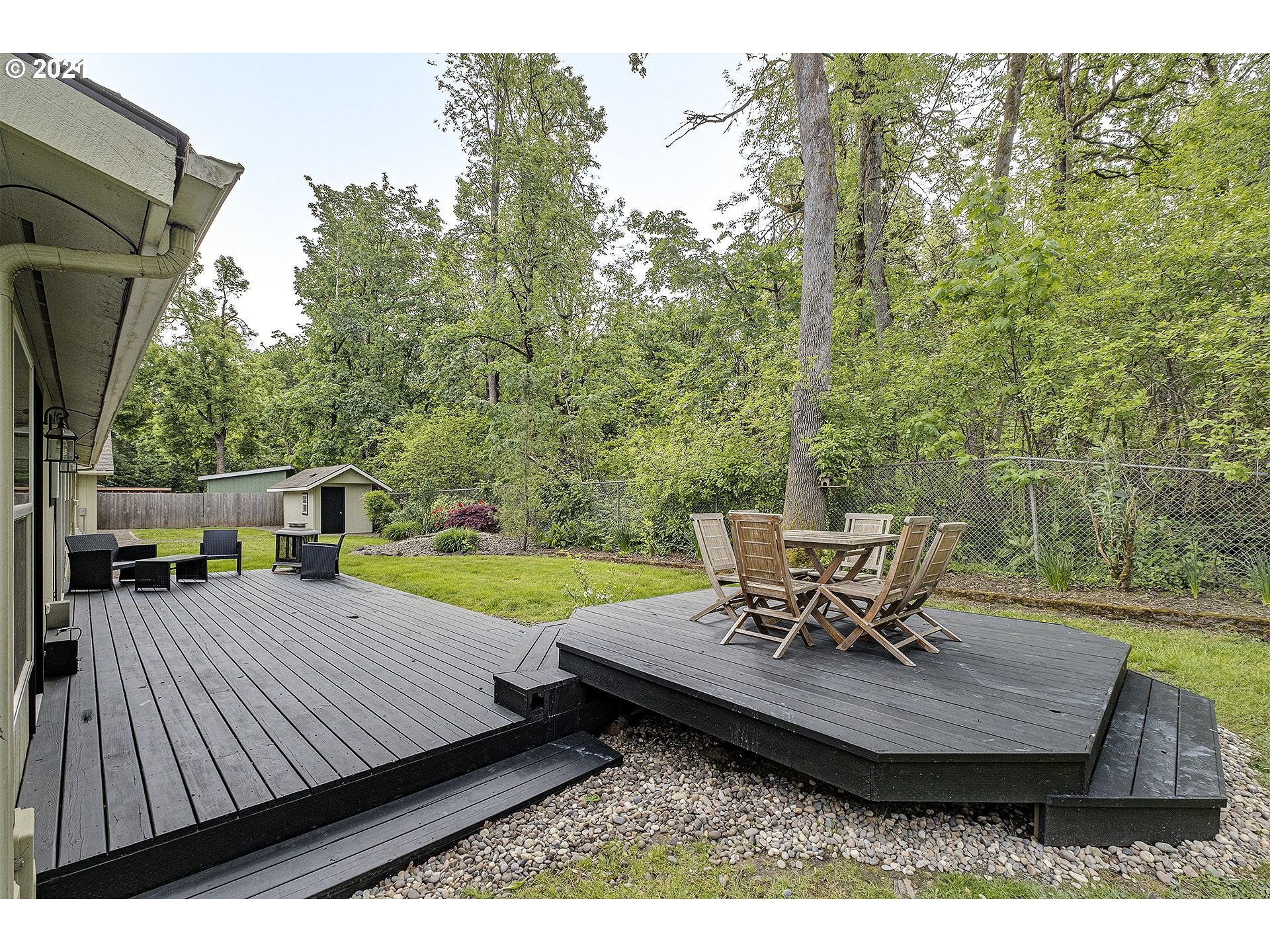 4300 Mapleton Drive West Linn, OR 97068 - Photo 29 of 32 a view of a patio with table and chairs and wooden floor