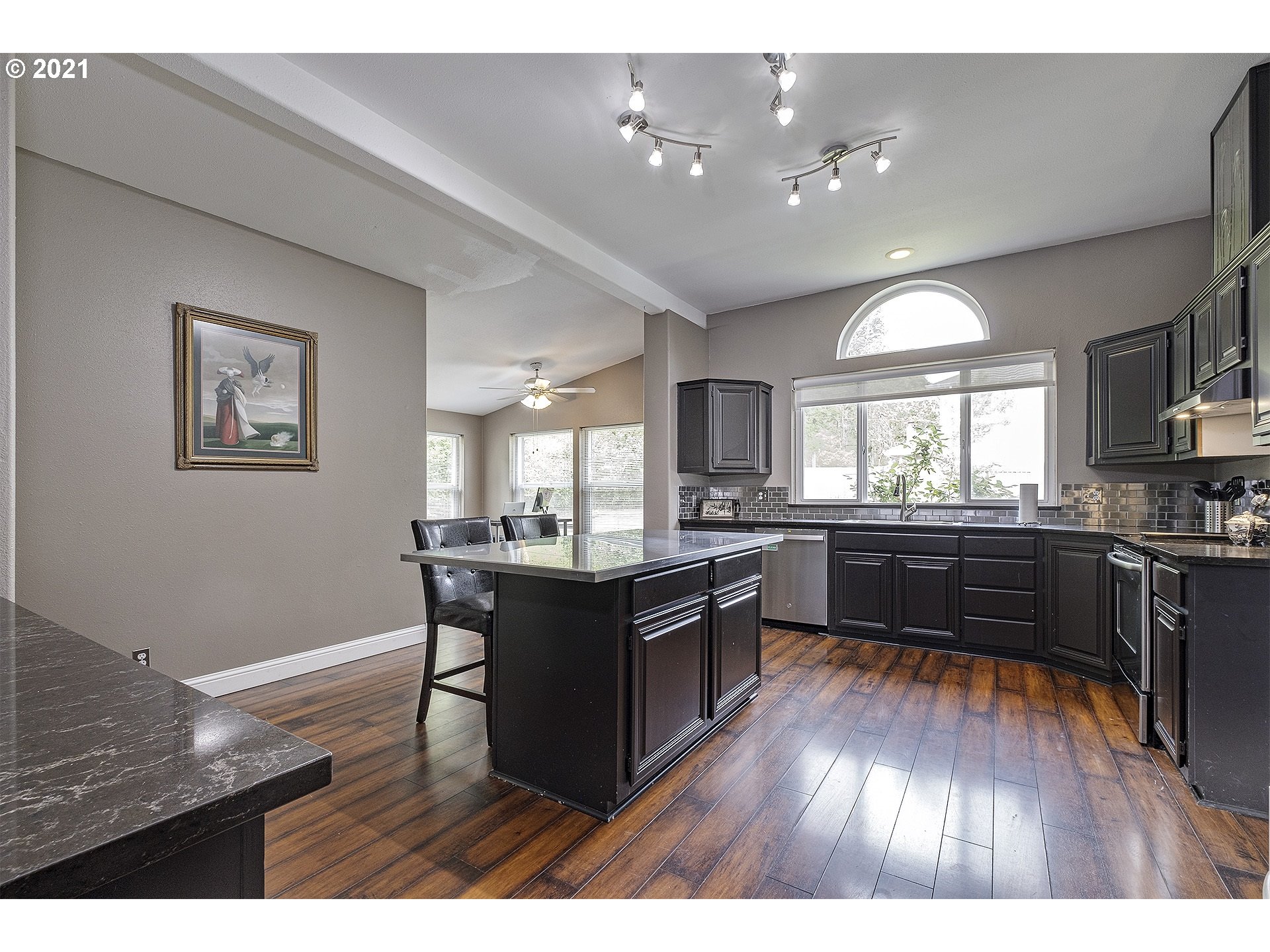 4300 Mapleton Drive West Linn, OR 97068 - Photo 9 of 32 a kitchen with a refrigerator and wooden floor