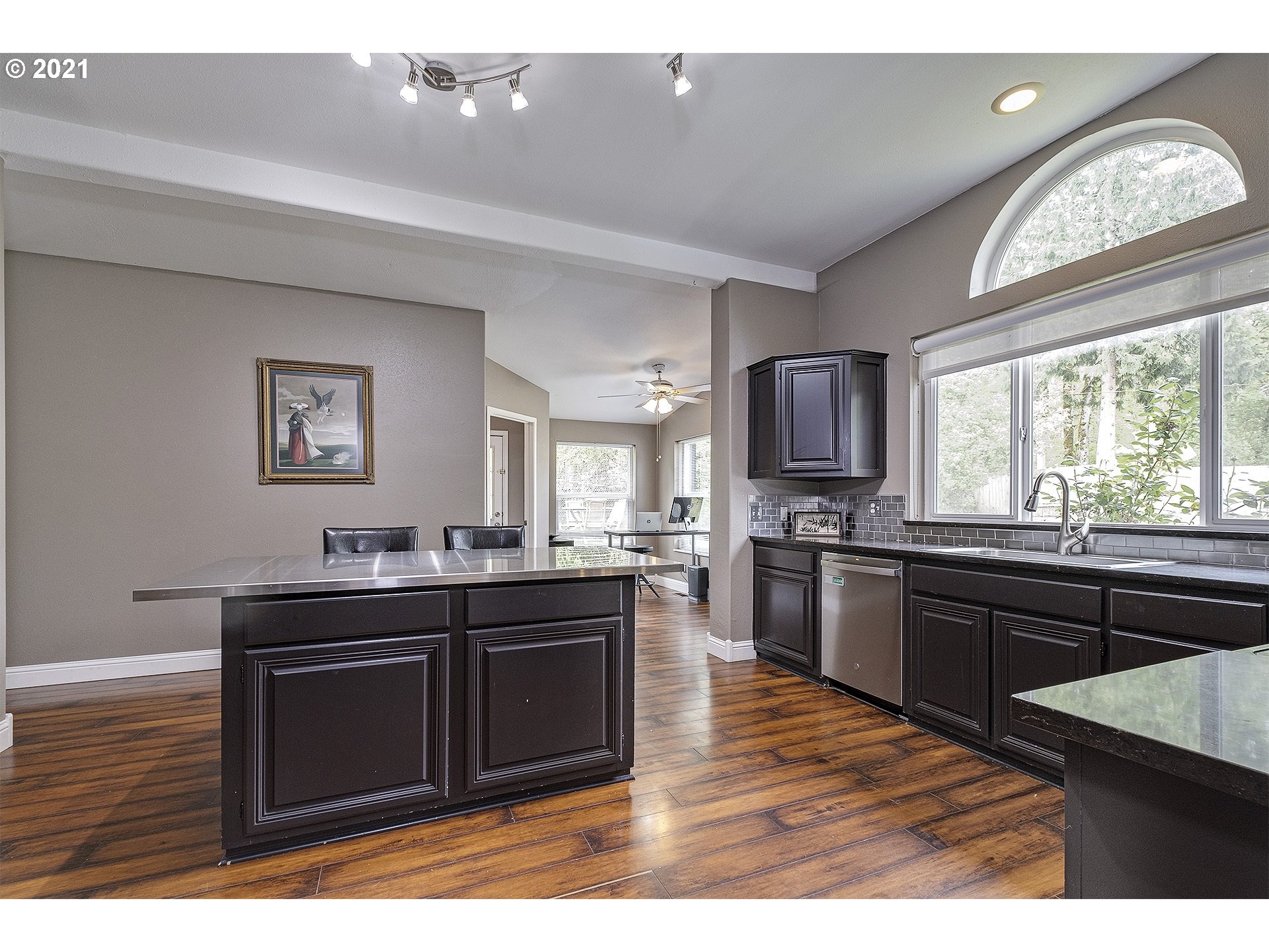 4300 Mapleton Drive West Linn, OR 97068 - Photo 10 of 32 a kitchen with granite countertop a stove cabinets and wooden floor