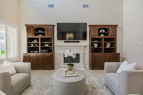 a kitchen with granite countertop a sink stove and refrigerator