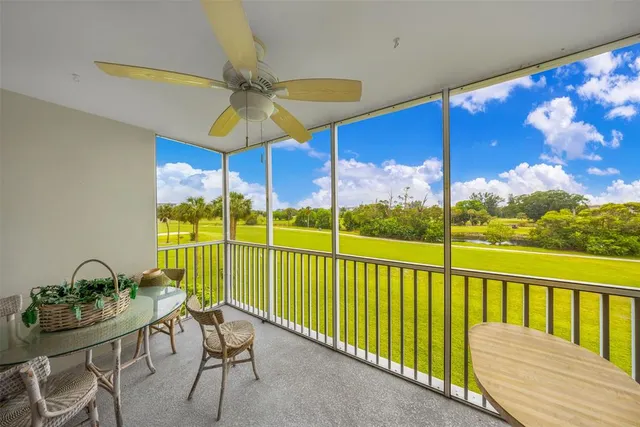 a view of a balcony with furniture