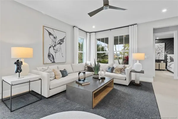 a living room with furniture and a large window