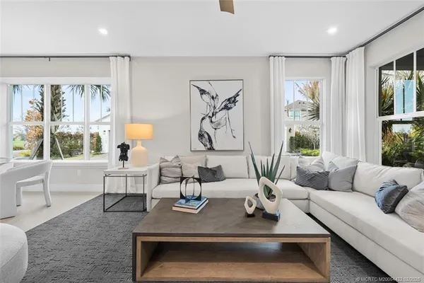 a bedroom with a bed and a potted plant