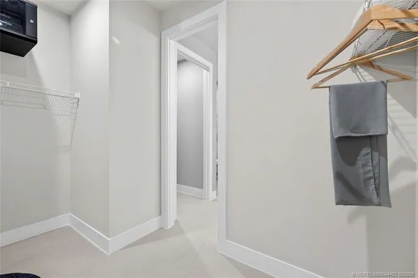 a living room with furniture and a book shelf