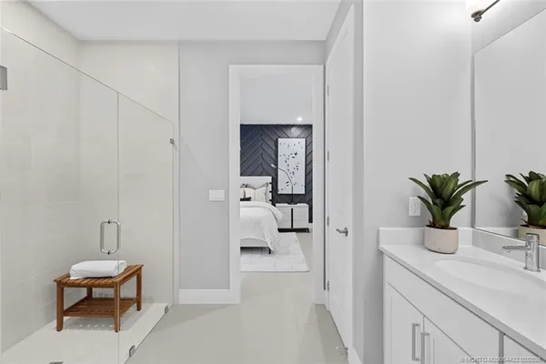 a living room with furniture and large window