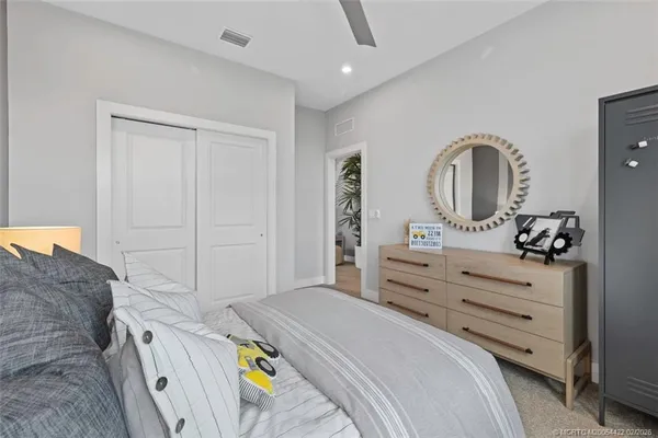 a white toilet sitting next to a bath tub