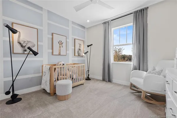 a room with furniture and a potted plant