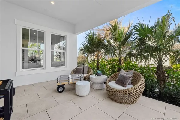 a kitchen with kitchen island a sink and wooden floor
