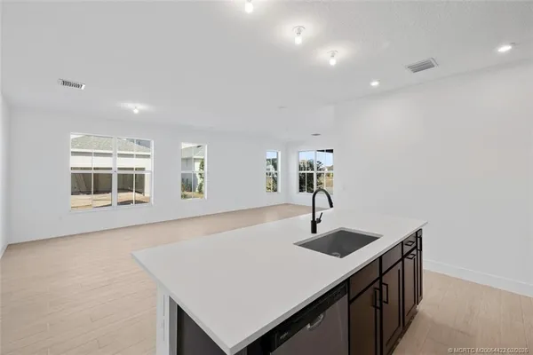 a kitchen with stainless steel appliances a refrigerator and a stove