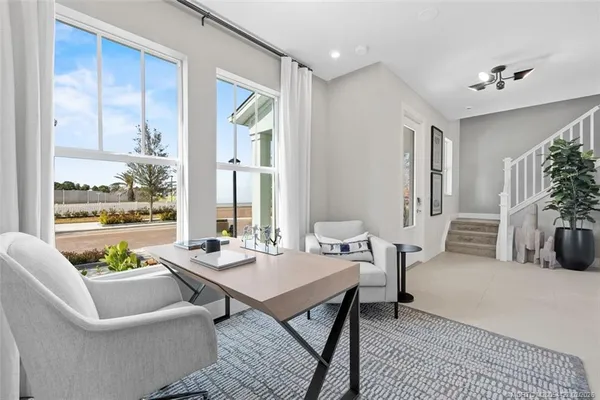 a view of living room with furniture and window