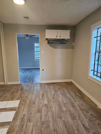 a view of empty room with windows
