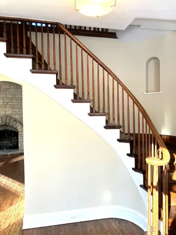 a view of staircase with wooden floor and staircase