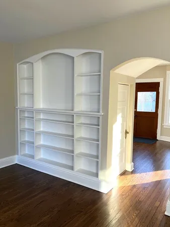 a view of a room with wooden floor and closet