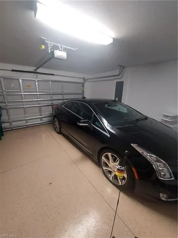 a room with furniture and chandelier