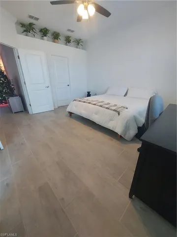 a bathroom with a double vanity sink toilet and mirror