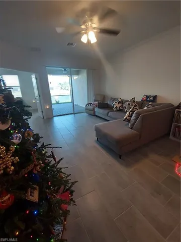 a kitchen with granite countertop a sink stainless steel appliances and cabinets