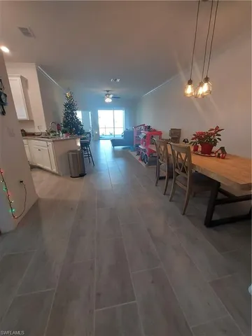 a bedroom with a bed window and wall painting