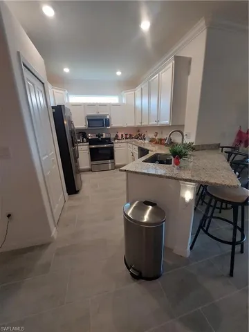 a room with furniture and gym equipment